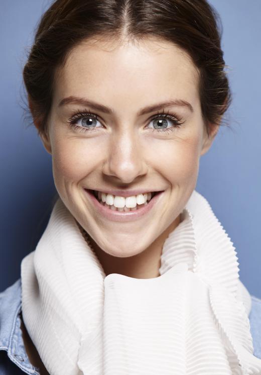 Some people use teeth-whitening strips to obtain a brighter smile.