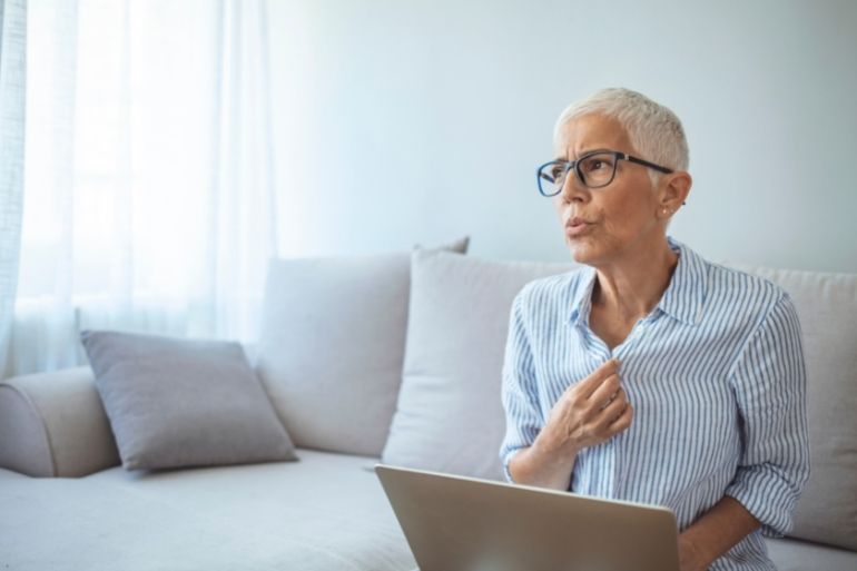 woman having hot flashes